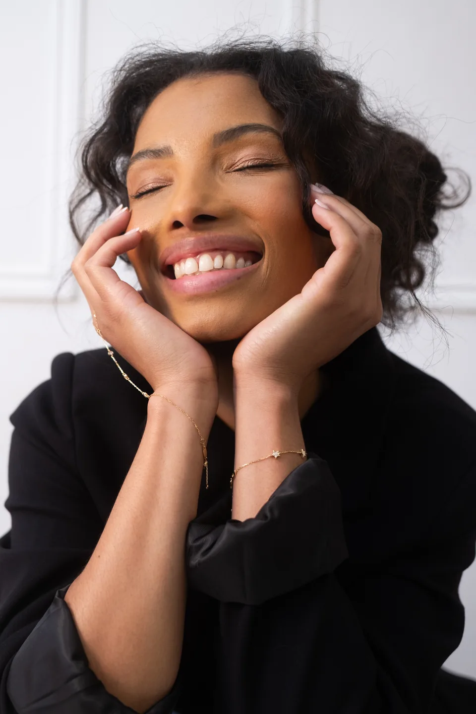 Smiling woman with hands on her face, influencer content